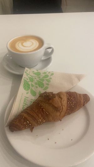 Croissant and oat latte (yum)  at Flow Specialty Coffee Bar & Bistro in Budapest