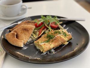 Tortilla vegana flow
con verduras asadas, microgreens frescos, crema de arroz con ajo  at Flow Specialty Coffee Bar & Bistro in Budapest