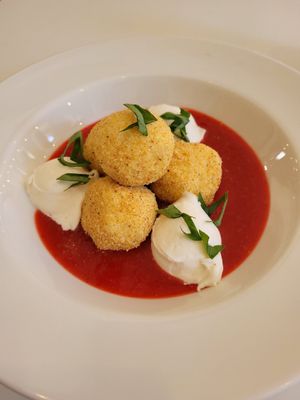 Sweet dumpling in strawberry sauce with cheese and basil. The dumplings had a weird texture and the sauce was bit too sweet at Flow Specialty Coffee Bar & Bistro in Budapest