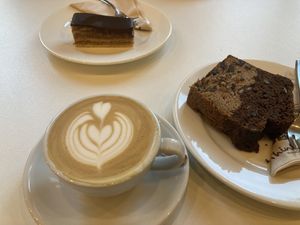 oat milk cappuccino and sweets  at Flow Specialty Coffee Bar & Bistro in Budapest