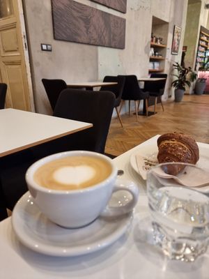 Oatmylk latte and jam-filled croissant - perfect #Veganuary brunch #Veganuary at Flow Specialty Coffee Bar & Bistro in Budapest