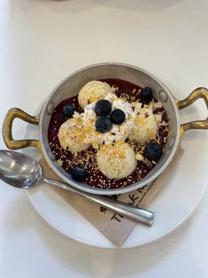 Semolina dumplings with berry compote and coconut cream  at Flow Specialty Coffee Bar & Bistro in Budapest