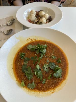 Weekly dish - red lentil Dahl with spicy oil; background - cottage „cheese“ dumplings  at Flow Specialty Coffee Bar & Bistro in Budapest