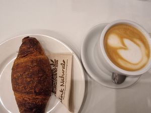 Ginger-jam croissant with oatmilk latte #Veganuary at Flow Specialty Coffee Bar & Bistro in Budapest