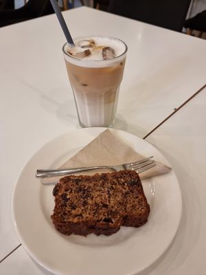 Iced oatmilk latte w/ banana bread at Flow Specialty Coffee Bar & Bistro in Budapest
