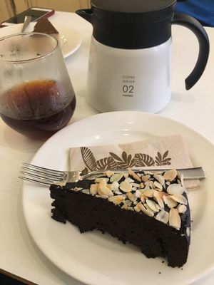 Coffee in a non-heat proof glass and a brownie.  at Flow Specialty Coffee Bar & Bistro in Budapest