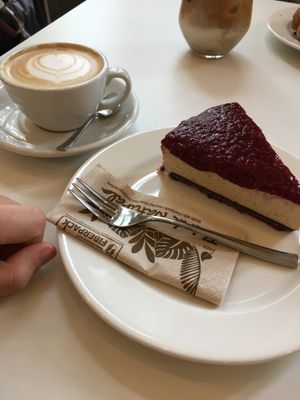 Coffee with oat milk and vegan raspberry cheesecake at Flow Specialty Coffee Bar & Bistro in Budapest