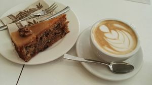 Delicious carrot cake and latte with oat milk at Flow Specialty Coffee Bar & Bistro in Budapest
