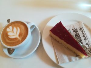 Plant-mylk cappuccino and a piece of cake at Flow Specialty Coffee Bar & Bistro in Budapest