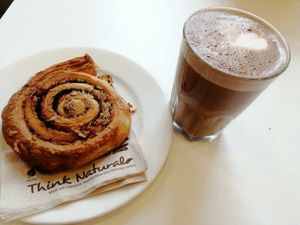 The best hot chocolate with oat milk and amazing cinnamon bun at Flow Specialty Coffee Bar & Bistro in Budapest
