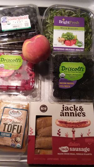 Organic fruit, sprouts, baked teriyaki tofu and jackfruit sausages. at Sprouts Farmers Market in Naples