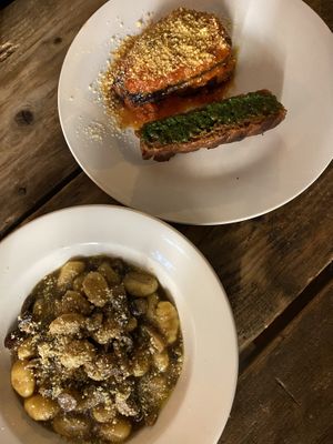Aubergine parmigiana with a side of focaccia, truffle mushroom gnocchi  at Plant Club in North London