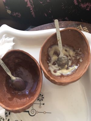 Rusty spoons in a dusty cup with mold at Cafe 82 in Galle