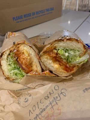 Exclusive joe vs the volcano sandwich with vegan fried chicken, pineapple, marinara, and vegan dirty sauce. at Ike's in Honolulu