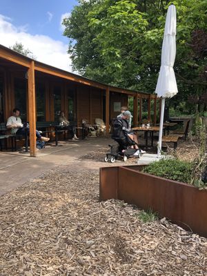 Seating area outside, with a view on the park at Vroesenpaviljoen in Rotterdam