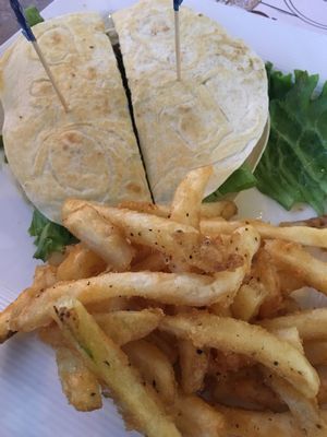 Impossible quesadilla burger with in house vegan bacon and crack pepper fries.   at Blondie's in Flint