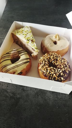 Banana cake, walnut doughnut, banana doughnut and chocolate doughnut - all so good! at Croissy in Deinze
