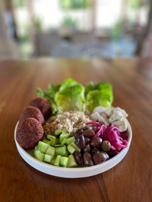 Beetroot falafel bowl.  Beetfoot and chickpea falafel balls, pickled red onion, kalamata olives, cucumber, quinoa, homemade vegan feta and romaine lettuce.   at Kayu Lembongan in Lembongan