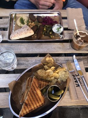 Falafel salad (top) and hummus toast with marinated tempeh (bottom) + iced latte with oat milk   at Kafé Magasinet in Gothenburg
