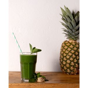 green glow smoothie with kale banana pineapple spirulina!! at LoveBurger in Berlin