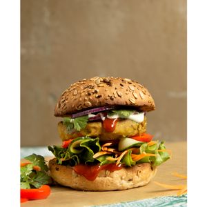 indian 'samosa style' burger with homemade patty, lettuce, carrots, cucumbers, onions fresh corainder and amazing curry sauce - delicious!! at LoveBurger in Berlin