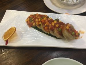 Lotus roots with tomato sauce and vegetables at DaFo Vegetarian in Guangzhou