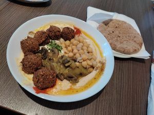 Amazing hearthy vegan hummus bowl with homemade falafels.  at Hummusbar in Sofia
