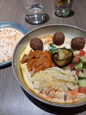 Hummus with falafels, salads and warm pita bread  at Hummusbar in Sofia