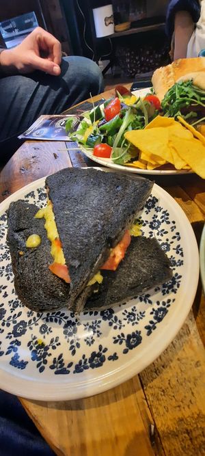 Cheese, tomato and pesto toastie on charcoal bread.. delicious, the cheese melted and tasted amazing! at Plantarium Cafe in Stratford-upon-avon