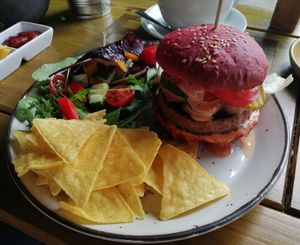 Burger with nachos and salad. (Burger is bigger than it looks, think its a perspective thing! 😉). at Plantarium Cafe in Stratford-upon-avon