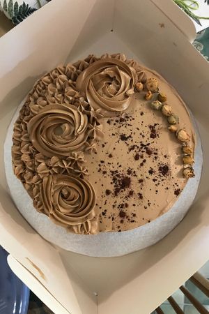 Custom made coffee & blackcurrant cake with rose decoration at Plantarium Cafe in Stratford-upon-avon