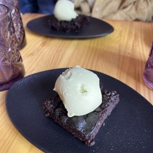brownie with avocado ice cream  at Avocado Love in Madrid