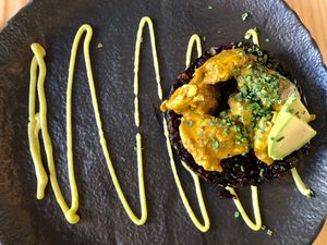 'Huera' curry with black rice, mushroom, and peanuts at Avocado Love in Madrid