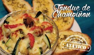 Mushroom, pepper, onion and tomato sauteed in butter, flavored with herbs, gratin baked with mozzarella and parmesan cheese, accompanied by garlic bread. at Atavico Cafe in Quito