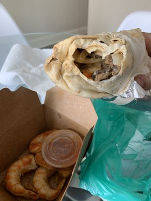 Portabella cheesesteak and a side of vegan shrimp.  at Refocused in Baltimore