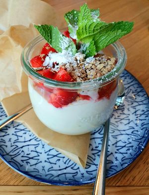 Almond yoghurt with fresh strawberries and topping at Wilma Wunder in Dusseldorf