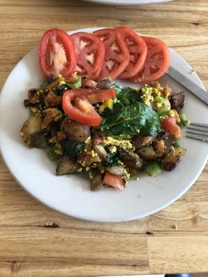 Tofu hash with sliced tomatoes  at Bluegrass Grill in Chattanooga