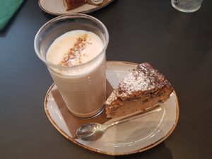 Oat chai latte with pecan-maple cake at Kalos Coffee & Luncherie in Luxembourg City