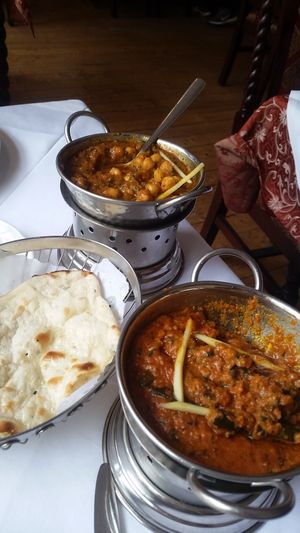 Okra and Chickpea Curry with Naan Bread. Rice is not pictured. The curry was absolutely delicious and bursting with flavor. All vegan. :) at Royal Panjab in Freiburg