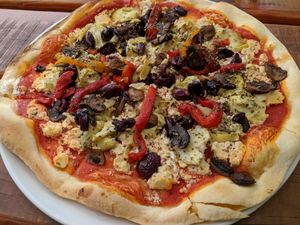 The vegetarian pizzas in the menu can be made vegan by substituting tofu (pictured) or hummus for cheese. at Moonshine Runners Diner in Sedgefield