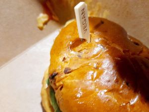 Cheezy And Scrumptious gouda Burger! This Slaps!! at Wisdom's Vegan Bakery & Cafe in Spring