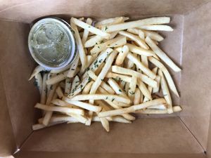 Pesto fries to go  at Wisdom's Vegan Bakery & Cafe in Spring