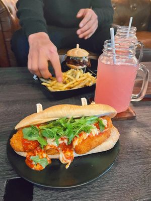 I got the Chick’n Parm Sub. (10/10) He got the BBQ Pulled Sandwhich (actually my favorite.) and some Parm fries which are always amazing. Two lemonades. ♥️😁  at Wisdom's Vegan Bakery & Cafe in Spring
