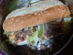 Philly cheese steak takeout, really good! at Wisdom's Vegan Bakery & Cafe in Spring