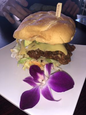 Spicy chicken sandwich with cheese and avocado added! at Wisdom's Vegan Bakery & Cafe in Spring