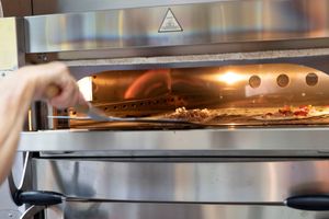 Baking flammekueches! ready in 2 minutes ... at Amelie Flam-kuche in Cambridge