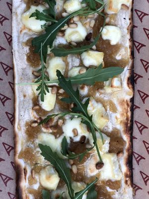 Goat cheese and caramelised onion flammekueche at Amelie Restaurant in Cambridge at Amelie Flam-kuche in Cambridge