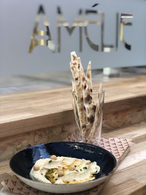 Hummus and baked flammekueche at Amelie Restaurant in Cambridge at Amelie Flam-kuche in Cambridge