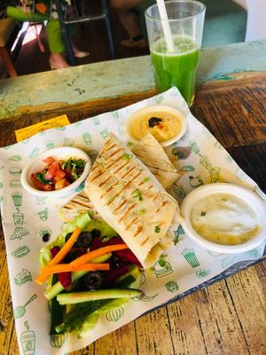 The falafel wrap with hummus, salad, tziki, and salsa. Delicious!  at Step Out Cafe in Jaipur