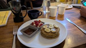 Vegan pancakes (green tea in the background) at Step Out Cafe in Jaipur
